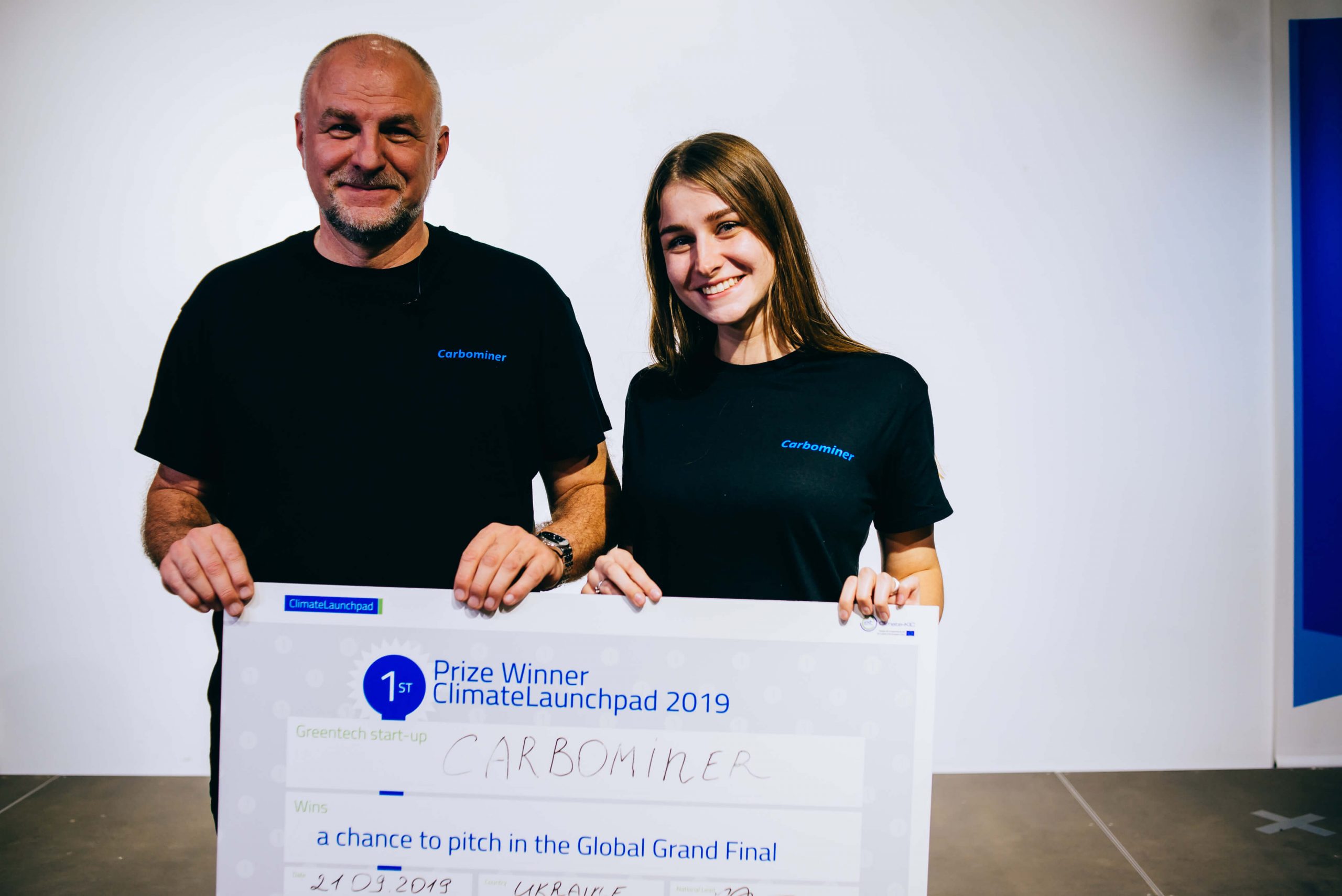 Founders of Carbominer holding the first prize for the ClimateLaunchpad National Final